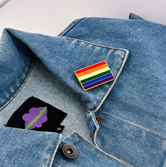 Pride Flag Enamel Pin on a jean jacket