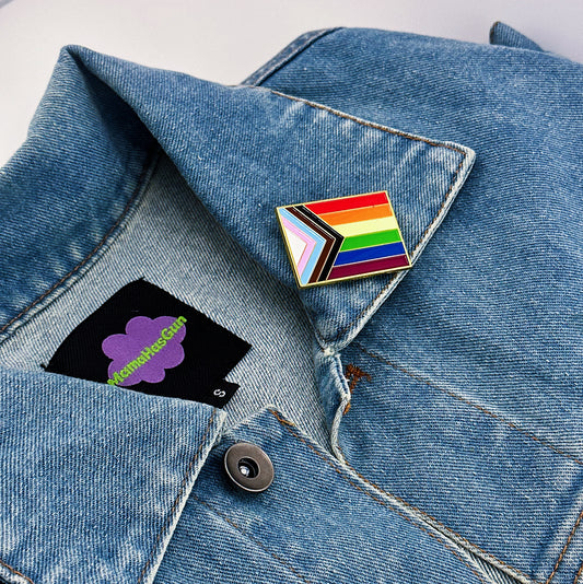 Progress Pride Flag Enamel Pin on a leather jacket