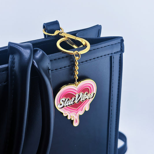 A melting pink heart on the back and Slut vibes written in the middle