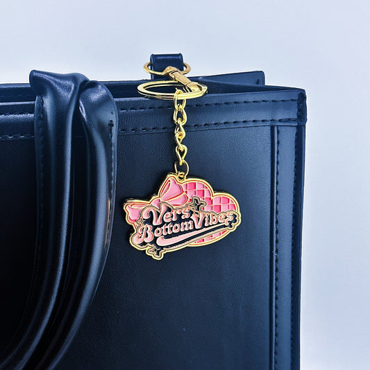 A Pink hearth on the back And vers bottoms vibes written in the middle