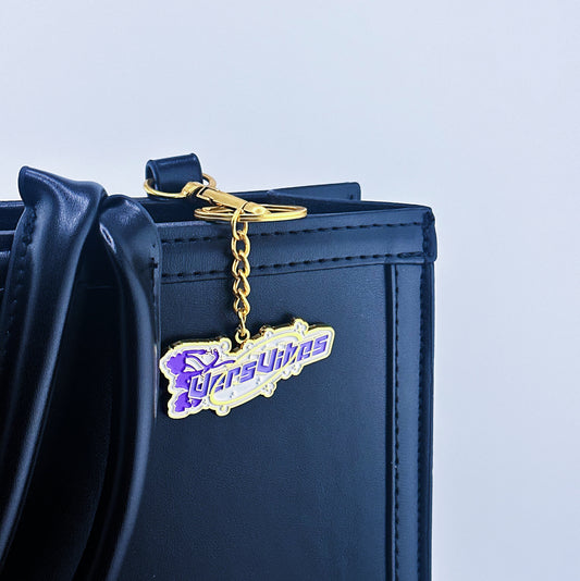 Sailor moon transforming on the background and Vers vibes written in the middle on a bag